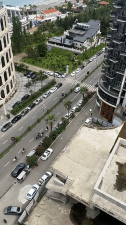 Horse riders navigate Batumi street as morning scenes unfold