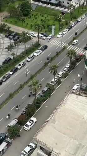Horse riders navigate Batumi street as morning scenes unfold