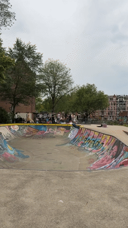 Colorful concrete skate bowl at an Amsterdam skatepark