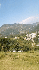 Green hills and blue skies from a mountain overlook