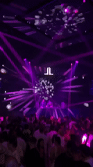 Patong nightclub packed under purple lights with live DJ set