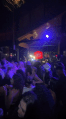 Nightclub gathering with live performance documented in North Kuta
