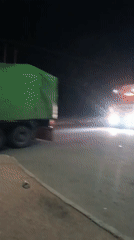 Night traffic activity with trucks and police in Bukuru
