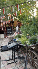 Live band plays outdoor celebration with festive decor and traditional touches
