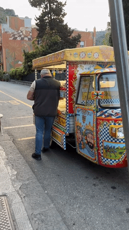 Sicilian street vendor and boutique shopping captured in Taormina