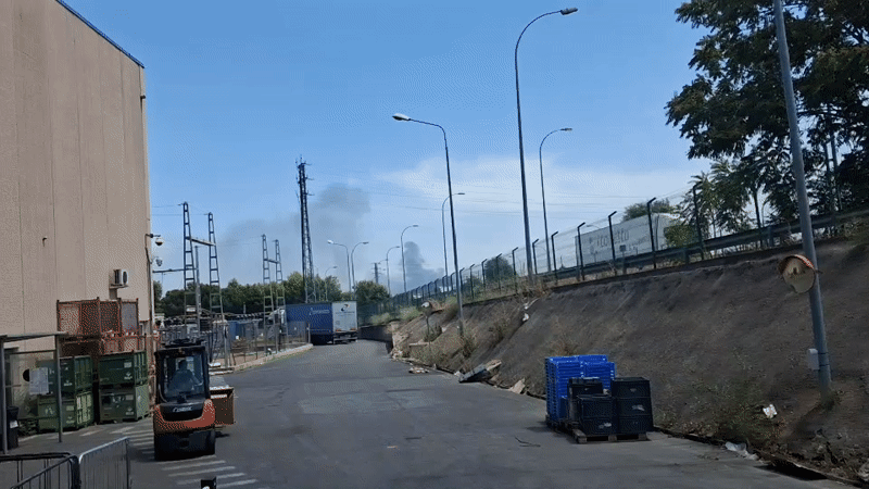 Industrial road near a Madrid warehouse on a midday afternoon