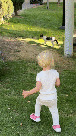 Toddler plays in Tel Aviv parks amid city skyline