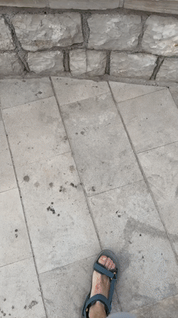 Stone steps lead to a sweeping view of Sveti Stefan's islet
