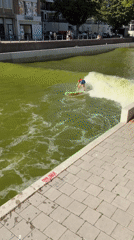 Urban surfer rides artificial river wave in Rotterdam