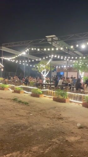Vietnamese restaurant operates under string lights with outdoor seating