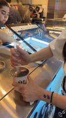 Woman enjoys bubble tea at Yerevan cafe
