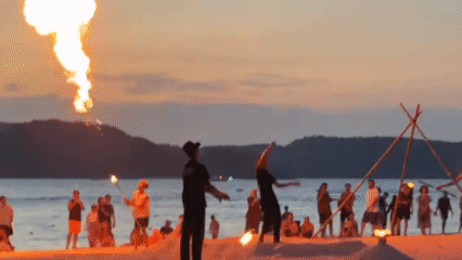 Fire performers draw sunset crowds at Malaysia's Cenang Beach