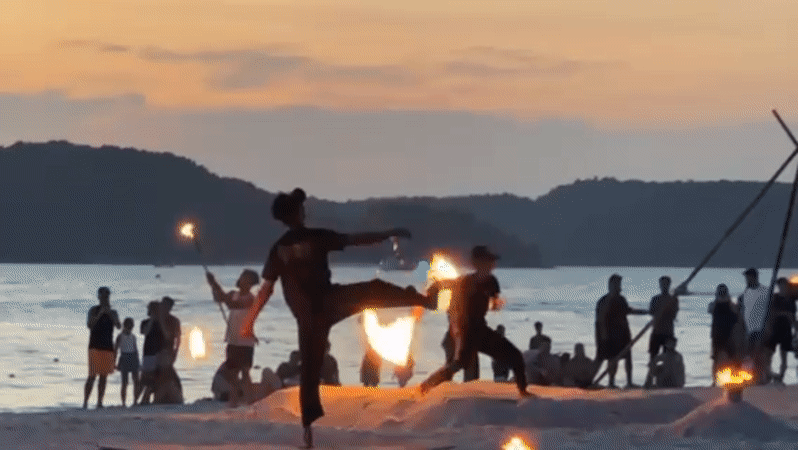 Fire performers draw sunset crowds at Malaysia's Cenang Beach