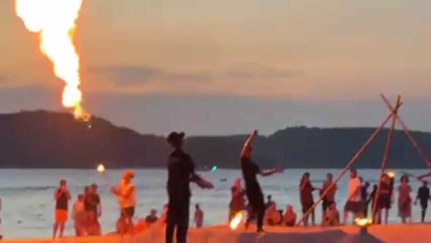 Fire performers draw sunset crowds at Malaysia's Cenang Beach