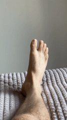 Person rests on bedding in Izhevsk apartment