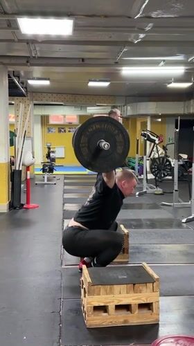 Man performs weightlifting routine at Blagoveshchensk gym