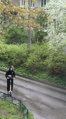 Two people share electric scooter ride in Staraya, Russia