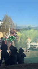 Cultural celebration with traditional dress, smoke displays in Velingrad
