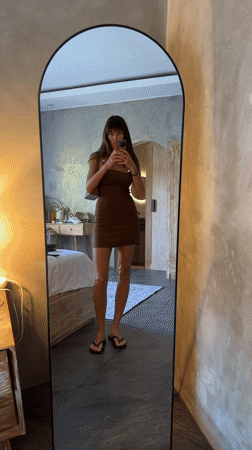 Mirror selfies in a North Kuta bedroom, brown beaded dress