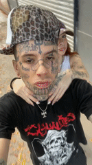 Tattooed individual with camera documented in Buenos Aires