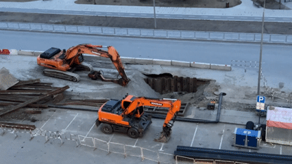 Construction excavators active at Tyumen roadside site