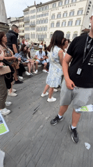 Tourist group explores Florence landmarks with maps and audio guides