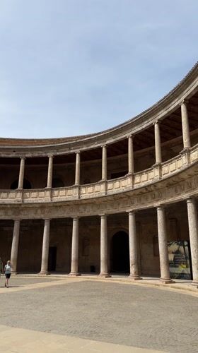 Tourist captures Palace of Charles V courtyard in Granada