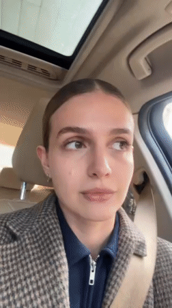 Woman photographed in BMW interior, Tbilisi morning