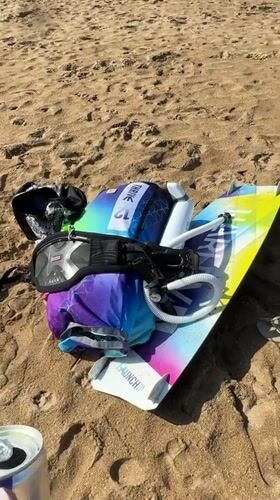 Red Bull and kitesurf gear on a Bali beach