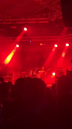 Live band performs under red stage lights in Kragujevac