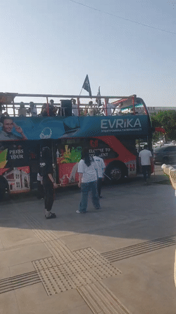 Press tour bus operates in downtown Shymkent, Kazakhstan