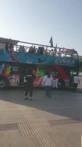 Press tour bus operates in downtown Shymkent, Kazakhstan