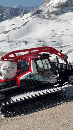 Snow groomer parked on alpine slope in Garmisch-Partenkirchen