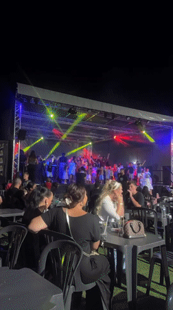 Outdoor concert night in Argelès-sur-Mer with stage lights and crowd