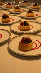 Elegant mini cheesecakes with berry garnishes served in Madrid