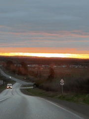 Dramatic sunset captured on rural road near Garevaya, Russia