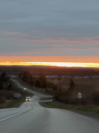 Dramatic sunset captured on rural road near Garevaya, Russia