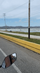 Motorcyclist records coastal road journey in Higuerote, Venezuela