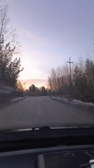 Sunset drive recorded on snowy rural road in Nizhnevartovsk
