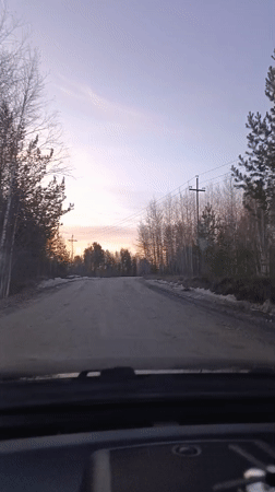 Sunset drive recorded on snowy rural road in Nizhnevartovsk
