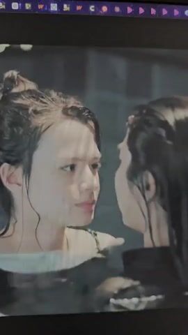This media file is a short video clip showing two individuals, likely young women, in what appears to be a body of water, possibly a pool or a hot tub. They are positioned very close to each other, with their faces almost touching. Water is visible, and the lighting suggests an indoor setting, possibly with artificial lights. The individuals have wet hair and appear to be looking at each other with an intimate or intense gaze. The overall mood seems calm and possibly romantic or emotional, given their proximity and facial expressions. There is no visible text in the clip. The provided location context of Kilkenny, Ireland, does not offer any visual cues within the video itself to confirm or deny this location.