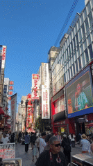 Morning street food vendors serve crowds in Osaka's Dotonbori