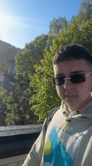 Student plays with orange balloon during casual day in Zlatograd