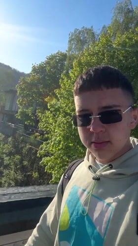 Student plays with orange balloon during casual day in Zlatograd