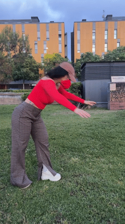 Person performs handstand on lawn in l'Hospitalet de Llobregat