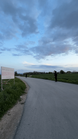 Person performs backflip in rural field near Shumen, Bulgaria