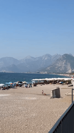 Konyaaltı Beach buzzes on a sunny August morning