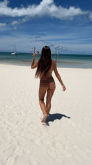 Beach morning at a Ban Tai resort, wading into clear shallow water
