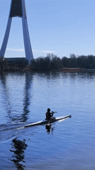 Morning kayakers paddle calm waters near Riga, Latvia