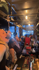 London bar hosts donut-eating contest with hanging treats